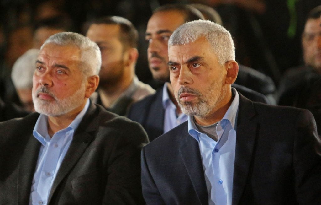 Yahya Sinwar (right) and Ismail Haniyeh (left) attend a memorial service for Hamas official Mazen Foqaha, who was shot dead by unknown gunmen, Gaza City, March 27, 2017. (Photo: Ashraf Amra/APA Images)