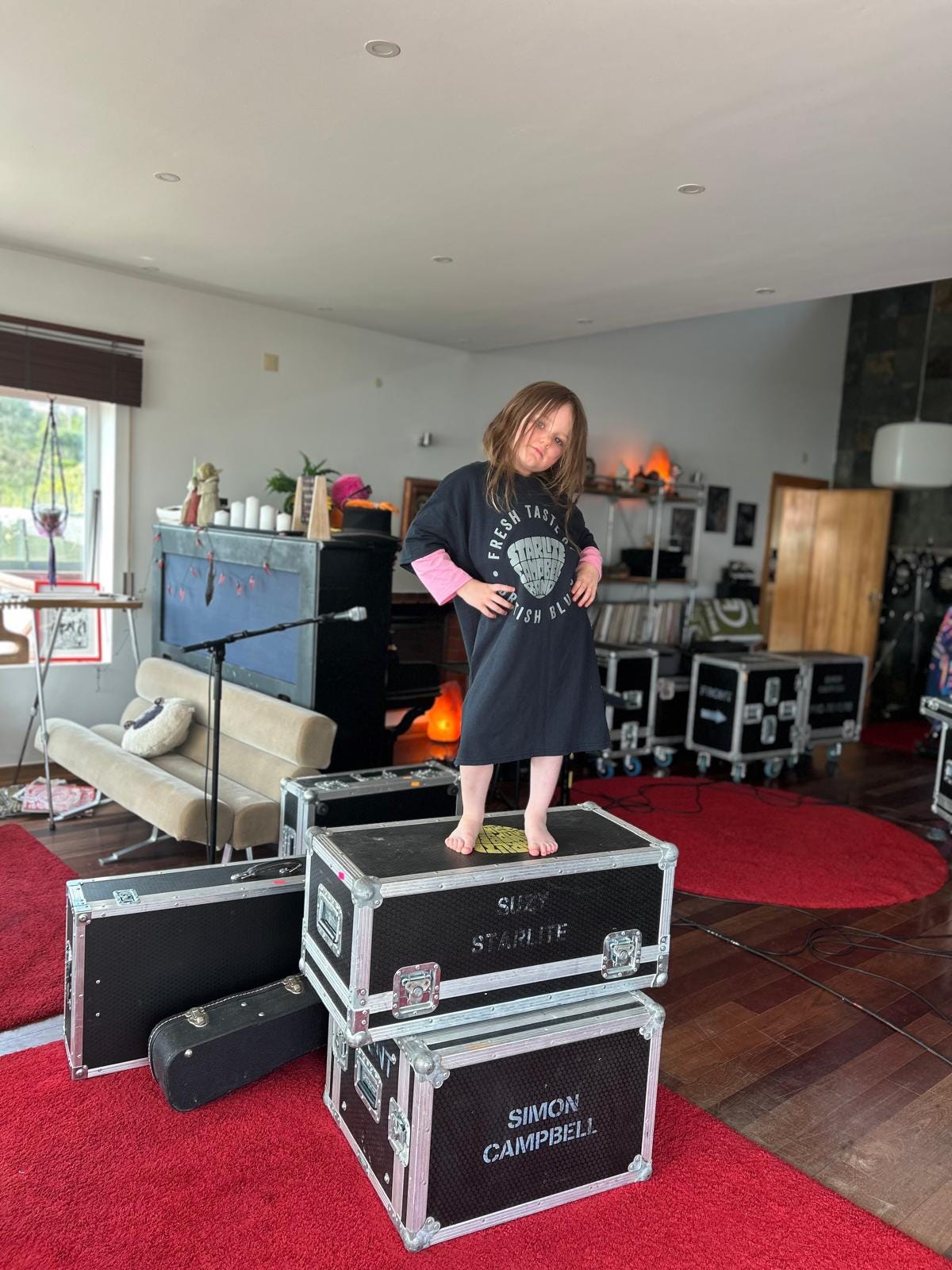 A girl standing on flight cases