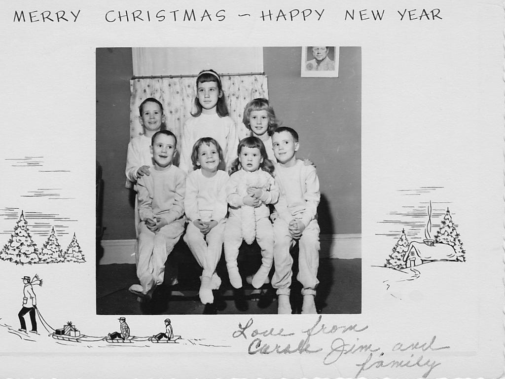 A black and white photo of a family

Description automatically generated with low confidence