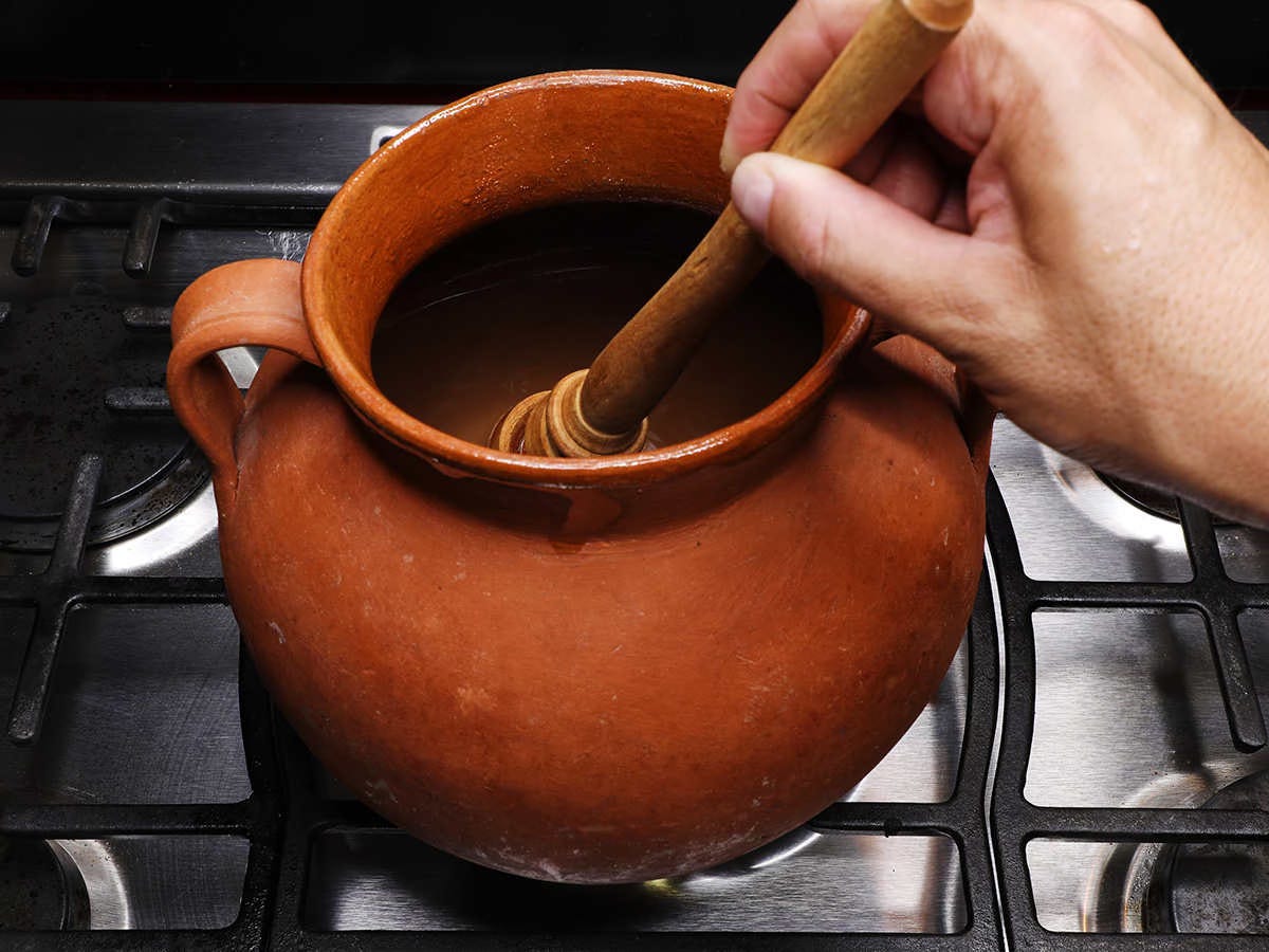 whisking chocolate and masa mix in pot