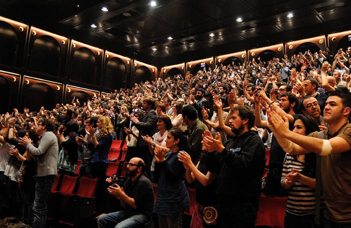 An audience giving a standing ovation – could they be the future of criticism? Photo: Christian Bertrand/Shutterstock