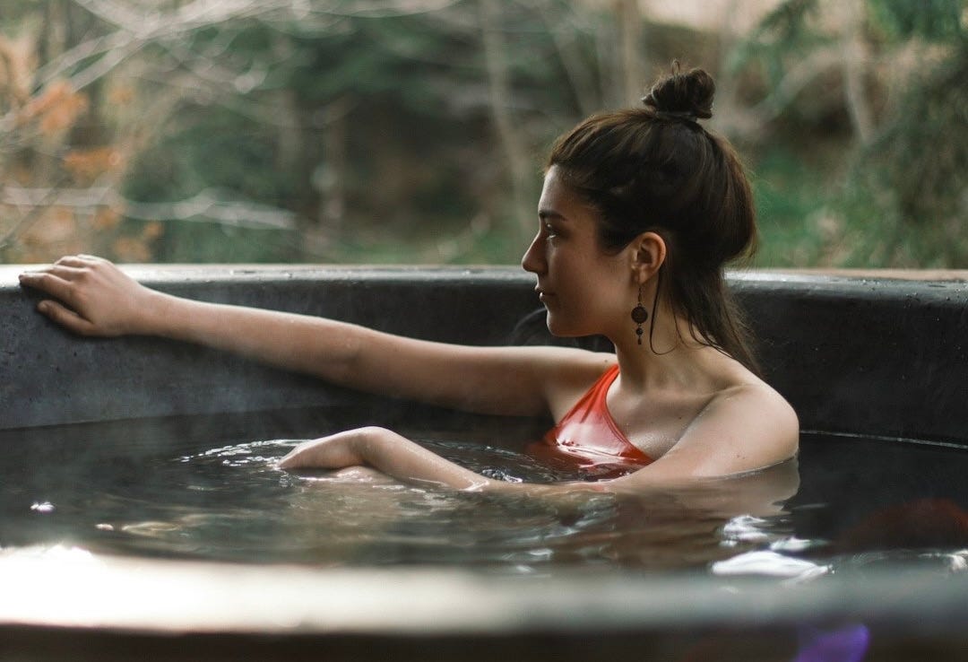 Woman sitting in hot tub