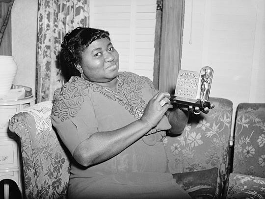 Hattie McDaniel at home with her Oscar
