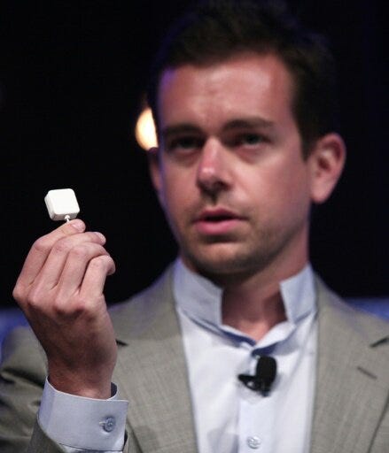 Jack Dorsey with an early version of the Square reader