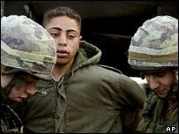 Hussam Abdo with Israeli soldiers
