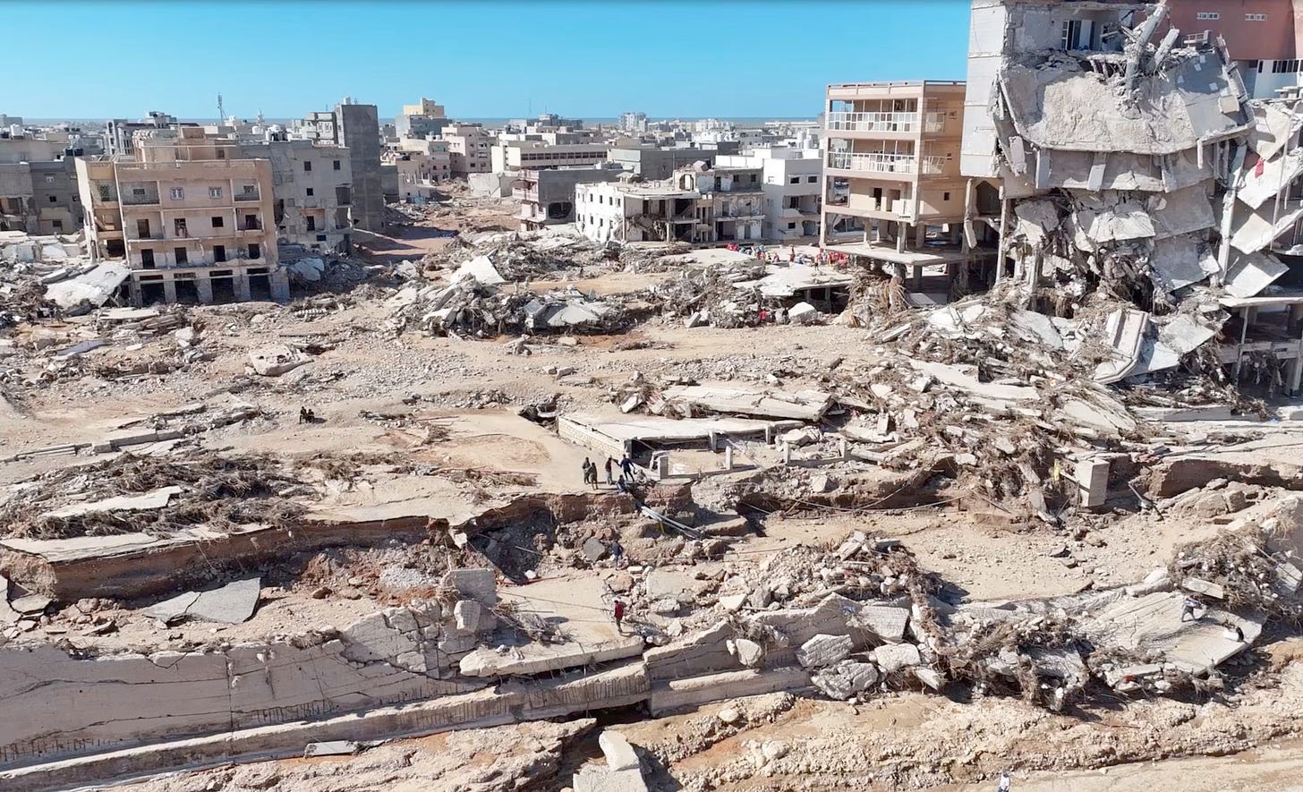 A destroyed landscape in Derna, most buildings leveled, the rest teetering on collapse.