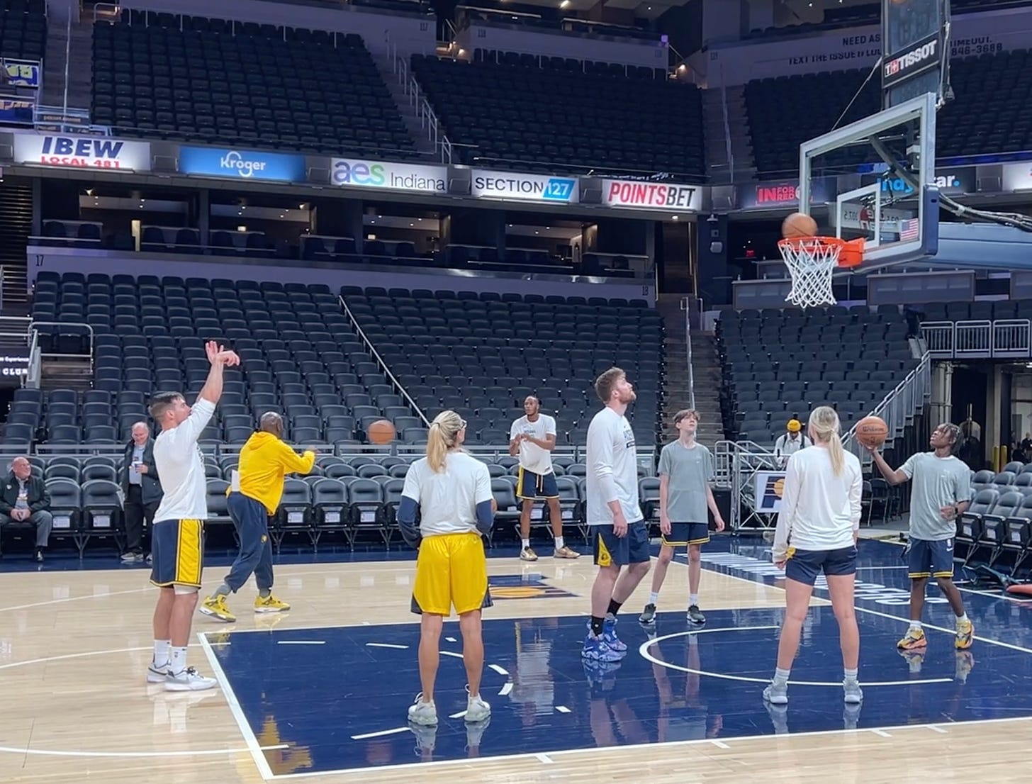 T.J. McConnell, Myles Turner warm up prior to their first home preseason game.