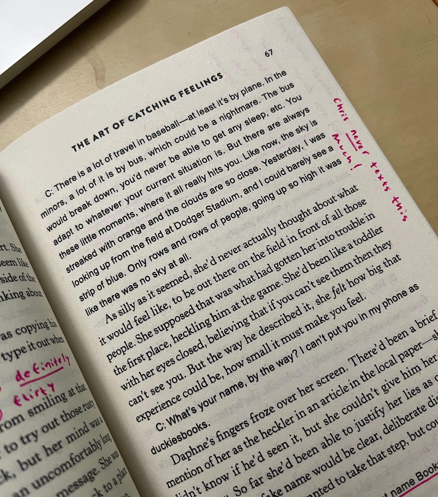 Picture of page 67 of The Art of Catching Feelings, showing a long text exchange where Chris talks about traveling in baseball and I wrote next to it in pink pen "Chris NEVER texts this much!"