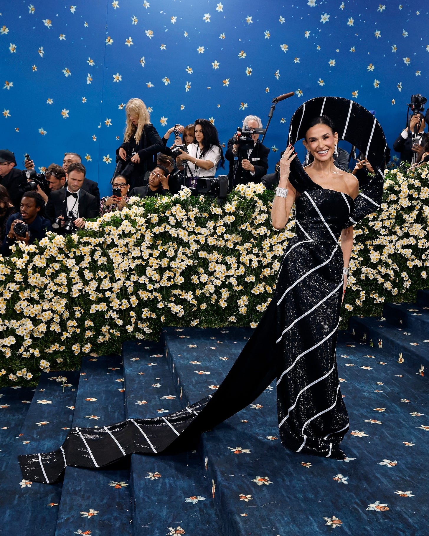 Demi Moore dressed as a Thom Browne necktie for the 2025 Met Gala - ABC News