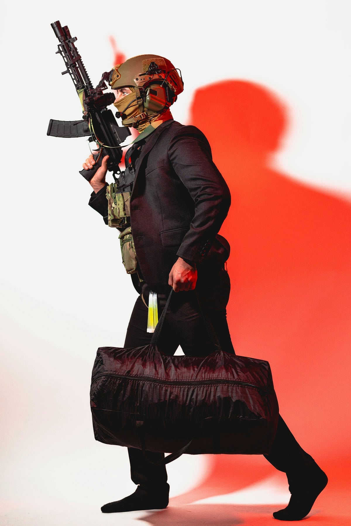 Man with mask, gun and bag of currency.