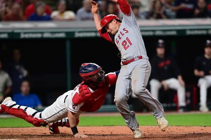 Cleveland Guardians catcher Cam Gallagher tags out Los Angeles Angels' Matt Thaiss during the eighth inning of a baseball game Friday, May 12, 2023, in Cleveland. The Angels won 5-4. (AP Photo/David Dermer)