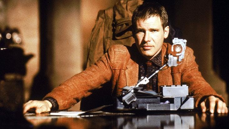 Still from Blade Runner of Harrison Ford preparing to administer a Voight Kampff test.