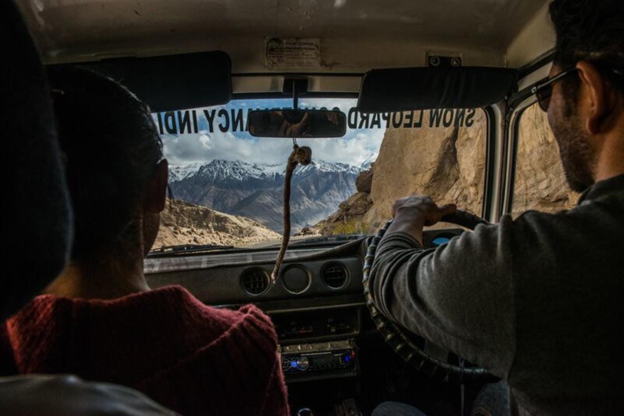 Namgail driving the jeep on a rough mountain road through the Himalayas in Ladakh.