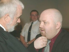 Brian Doyle (right) speaks to lawyer John Duggan in Newfoundland and Labrador Supreme Court in St. John’s in 2002. TELEGRAM FILE PHOTO