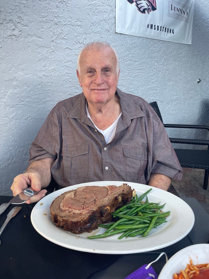 My Dad, happy because he’s about to eat a massive prime rib.