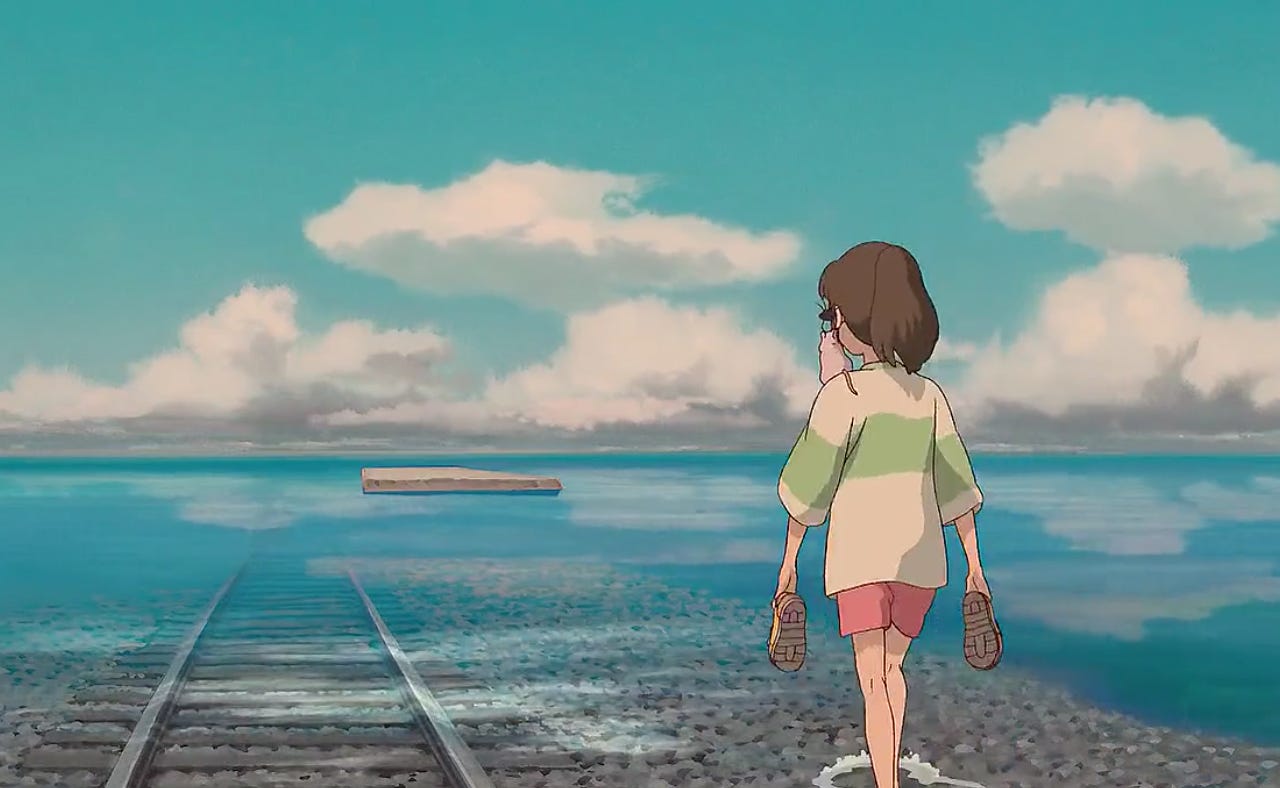 Chihiro (the protagonist of Spirited Away) walking barefoot along train tracks in shallow water, her shoes in hand.