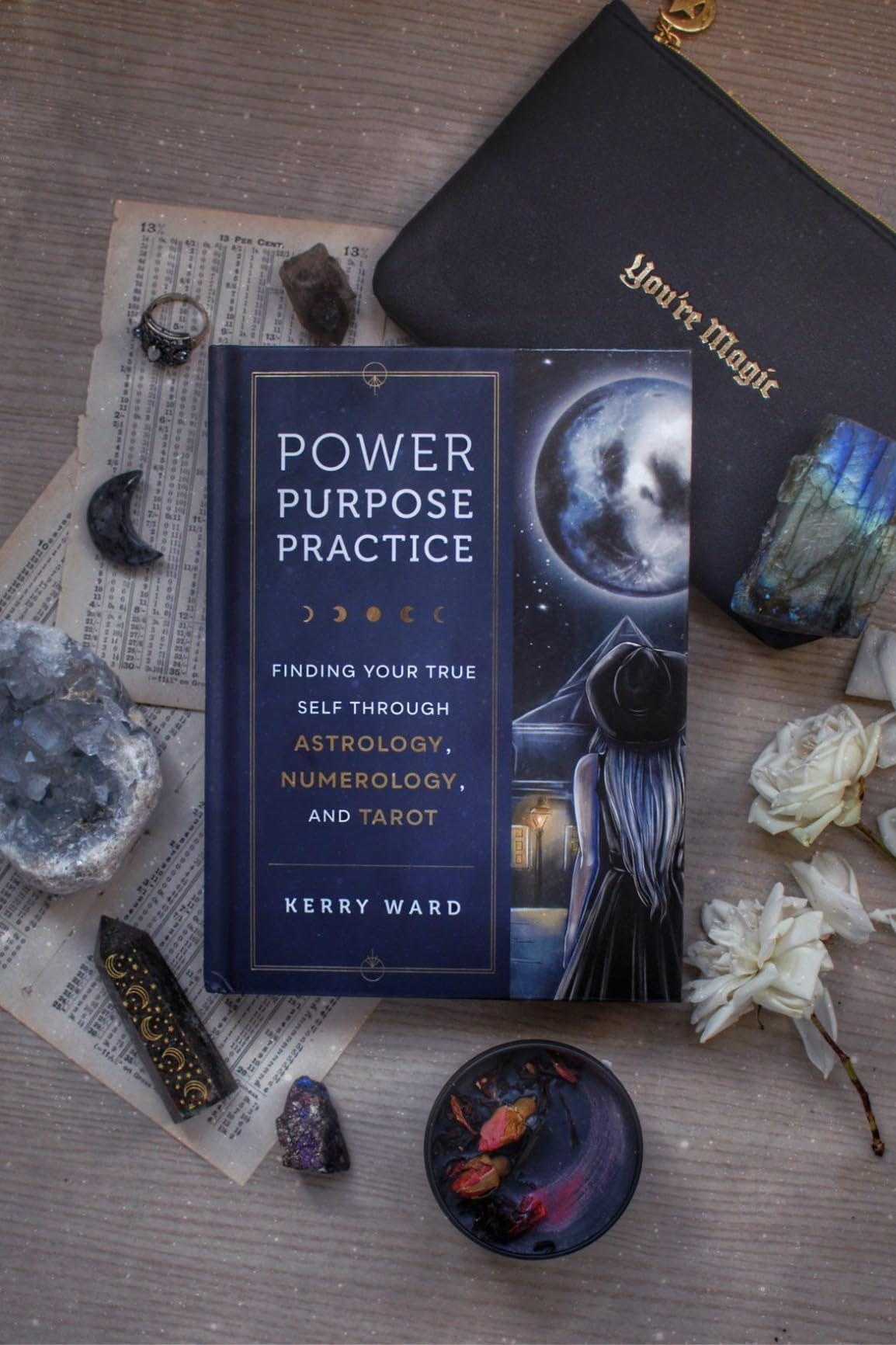 A flatlay photo featuring the harcover edition of Power, Purpose, Practice by Kerry Ward