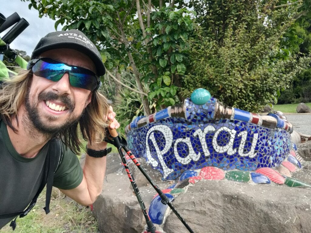 Hairy hiker Dunc leans in for a selfie with the Parau sign