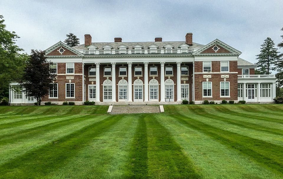 A large Georgian-style building with large columns and steps.