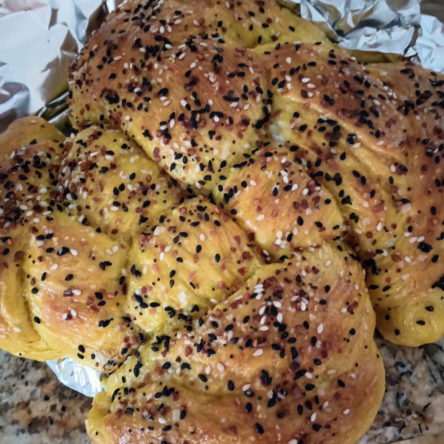 round challah with sesame seeds
