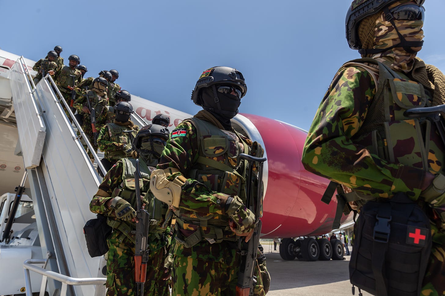 A contingent of Kenyan police officers arrive in Port-au-Prince in July to dismantle armed criminal gangs operating in Haiti. (Photo by Guerinault Louis/Anadolu via Getty Images.)