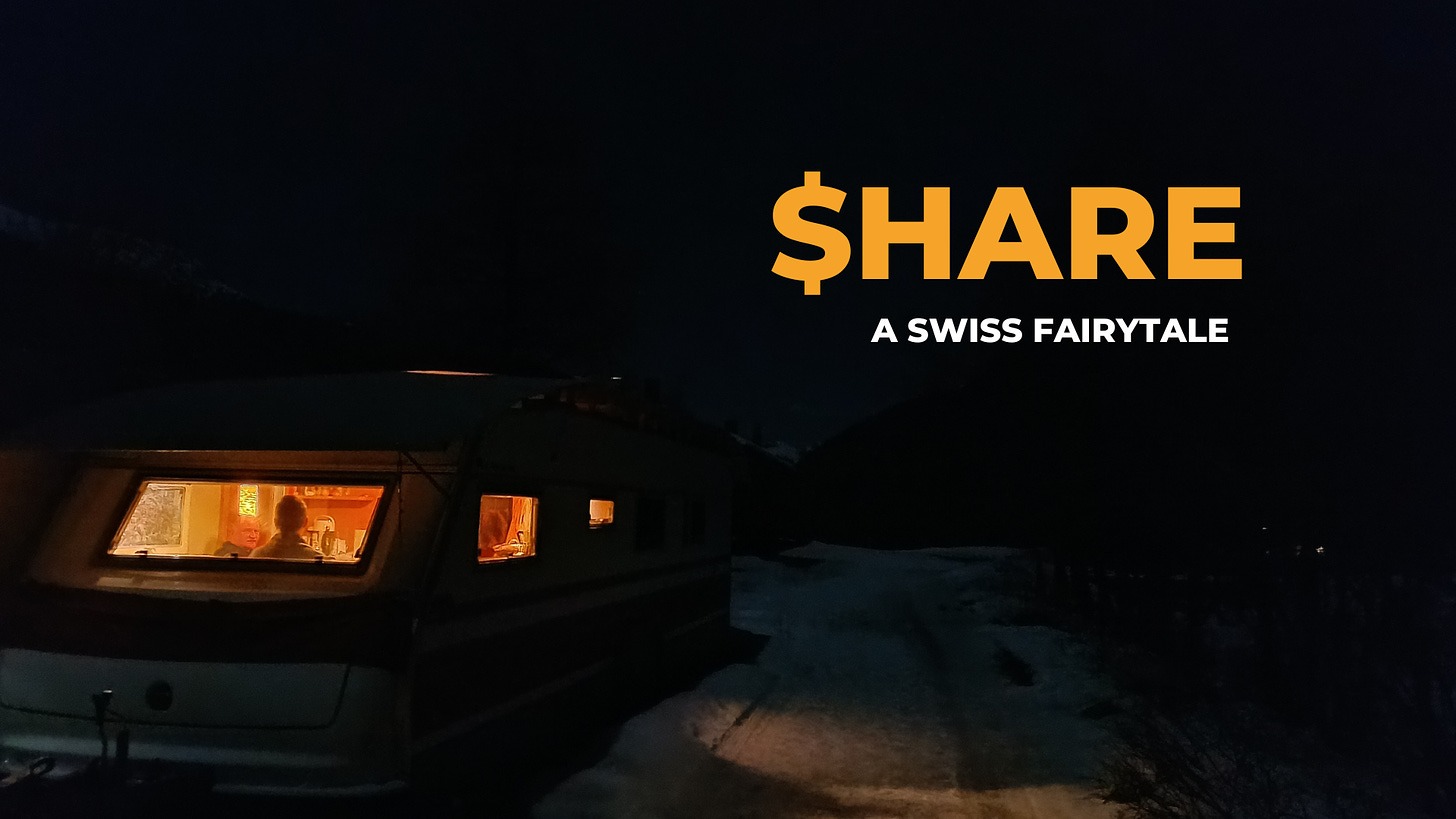 A caravan on a Swiss wintercampsite at night