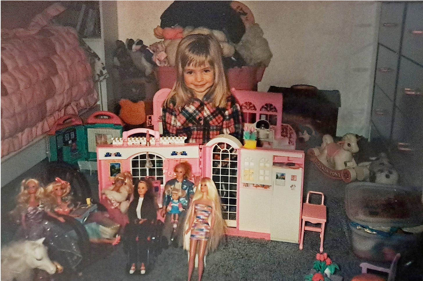 Image of me as a child with all of my Barbies