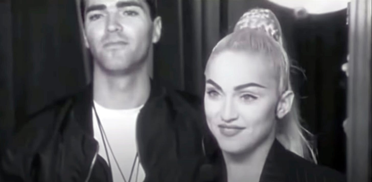 Madonna and brother Christopher chat near a mirror about her possible arrest on Truth or Dare