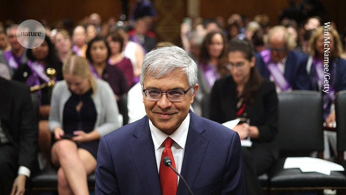 Jay Bhattacharya smugly grinning before a camera, literally the only thing he is capable of doing.