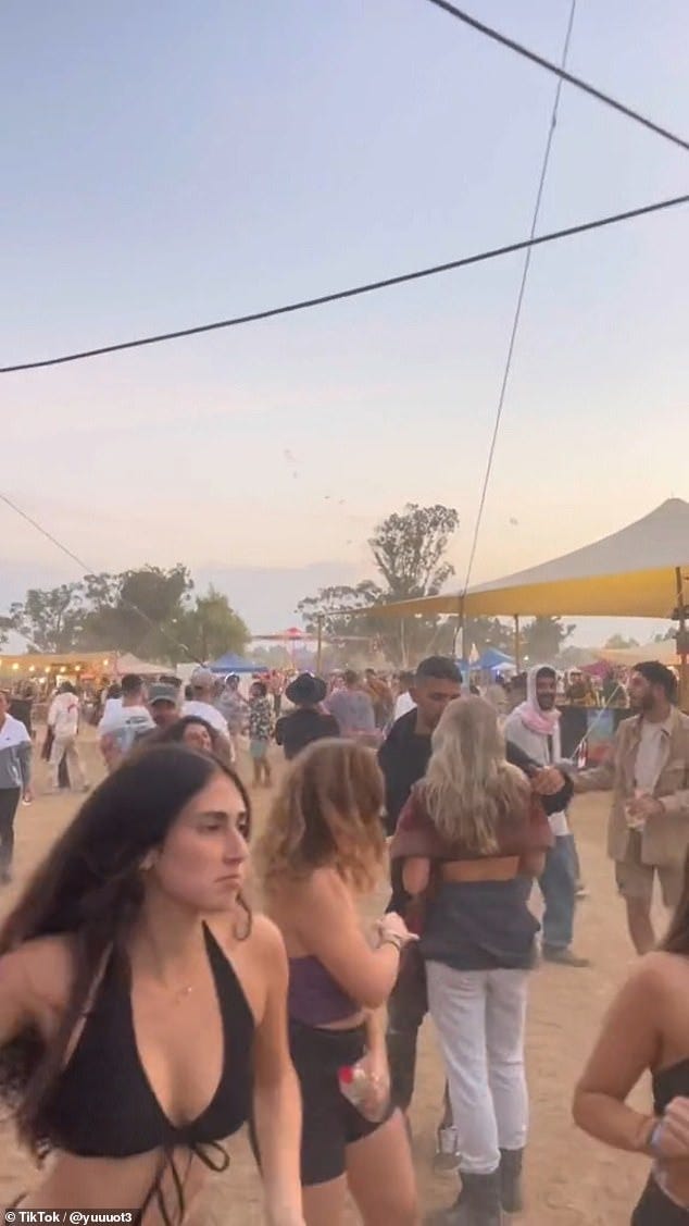 Israeli festival goers could be seen dancing in the desert at dawn on Saturday, completely unawares that within minutes members of the Hamas militant group were about to descend from the skies and inflict terror