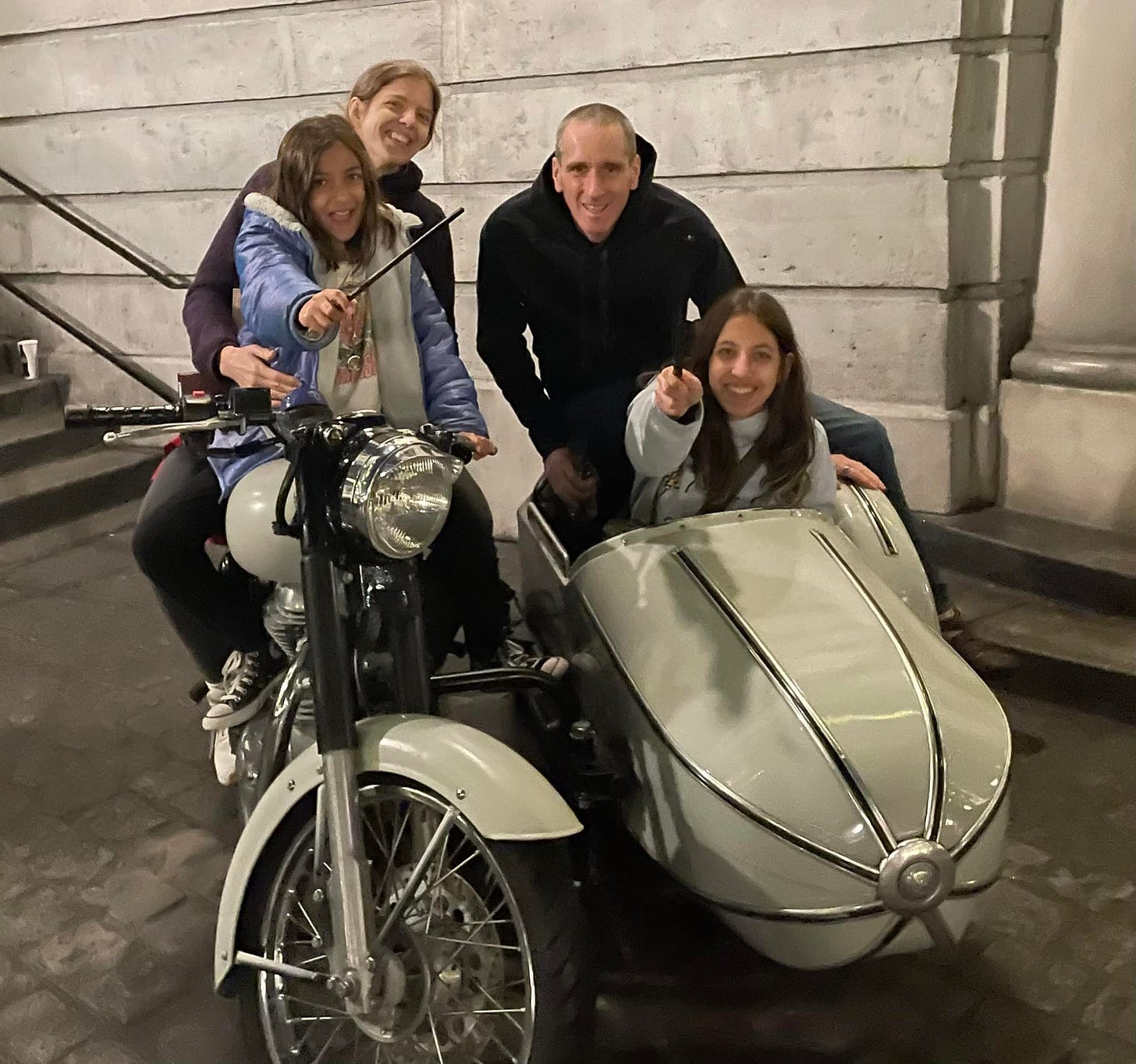 May be an image of 3 people, scooter and motorcycle