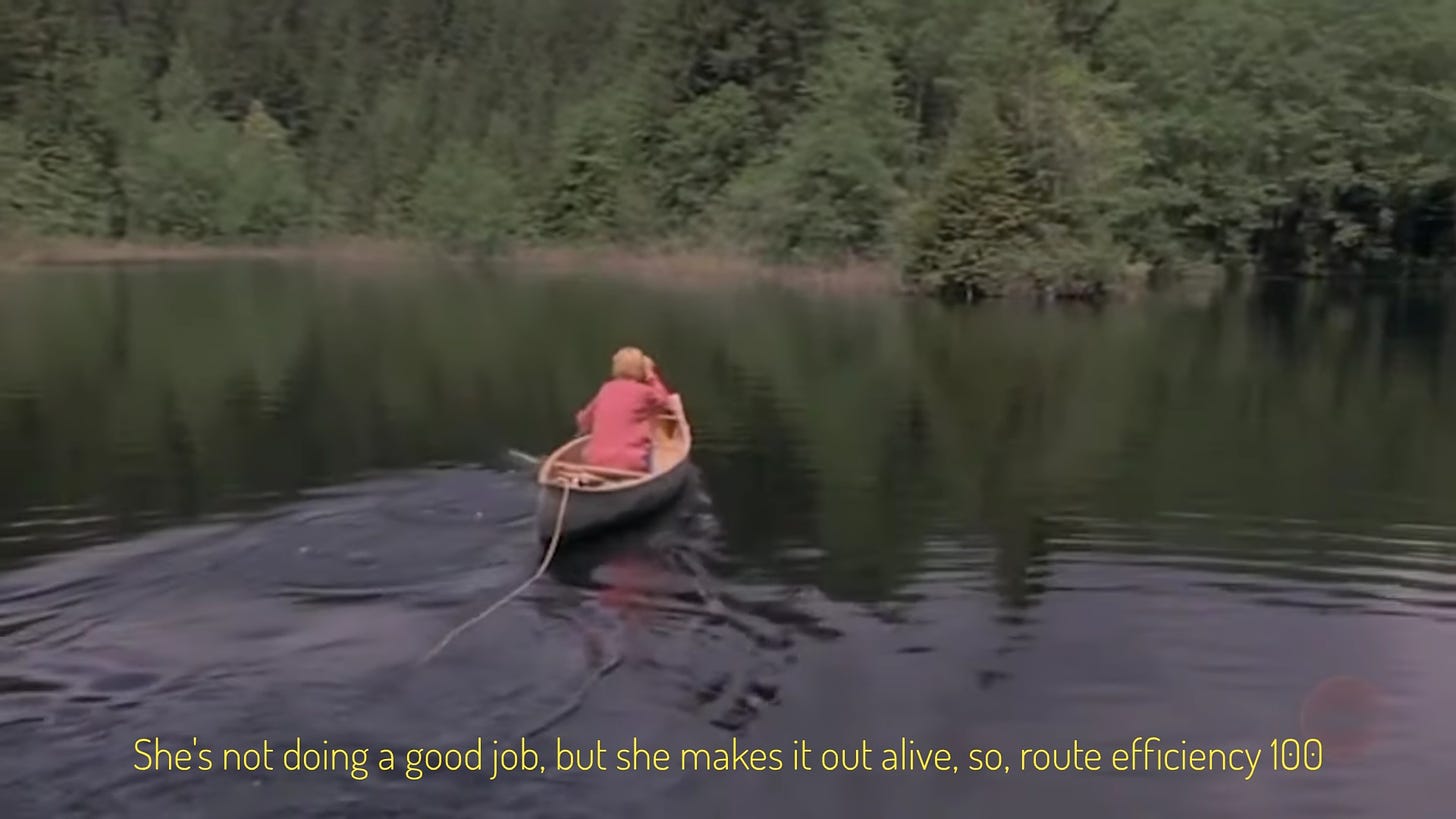 Laurel badly paddling a canoe on a piney lake, captioned "She's not doing a good job, but she makes it out alive, so, route efficiency 100"