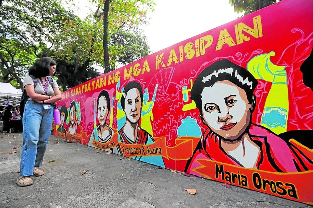 CELEBRATED FEMININE An outdoor artwork depicting Filipinofemale icons in history, art and education highlight the observance of International Women’s Month on the campus of the University of the Philippines Manila, in this photo taken on March 14.