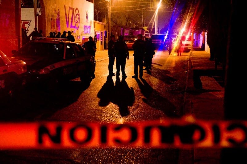 Police and soldiers stand outside a bar in Ciudad Juarez, Mexico, minutes after an execution occurred inside on April 18, 2009. Police and soldiers stand outside a bar in Ciudad Juarez, Mexico, minutes after an execution occurred inside on April 18, 2009.
