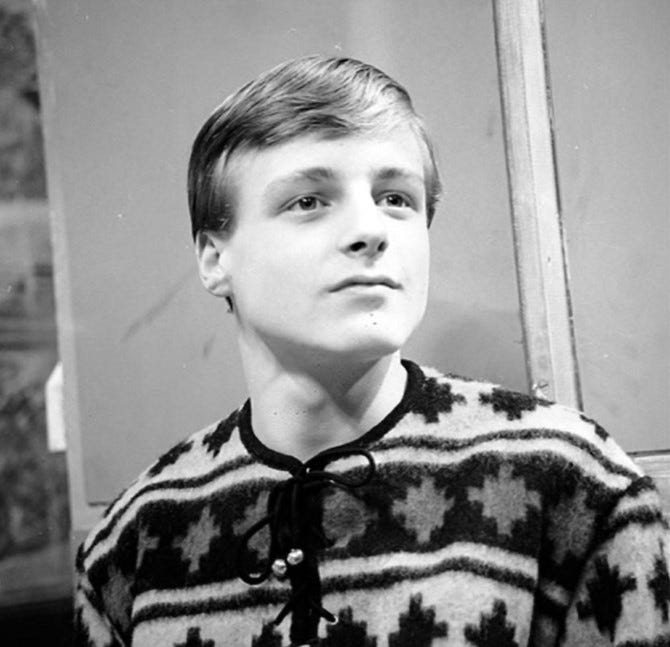 A youthful-looking Michael Craze in a loud cardigan