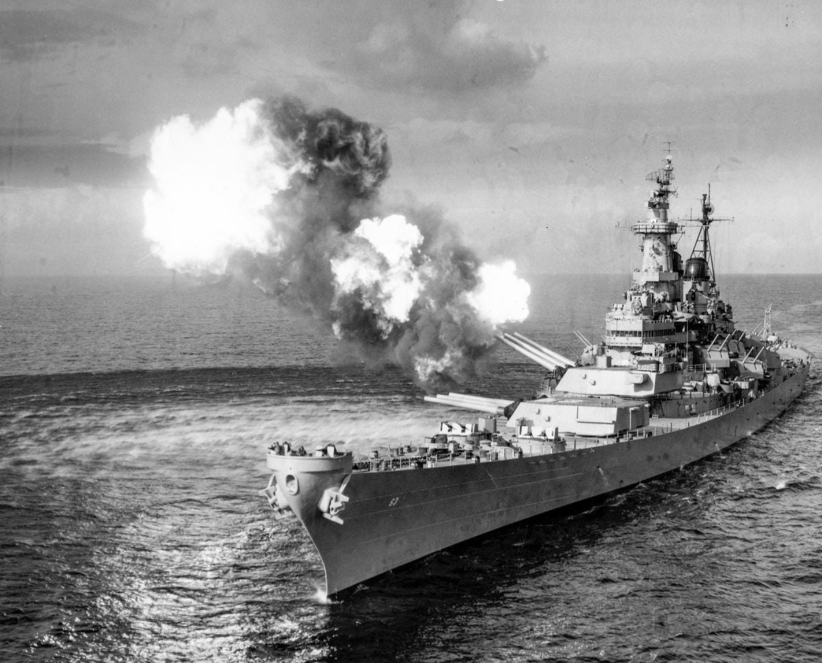 American Battleship USS Missouri shooting it's main guns, from World War 2 