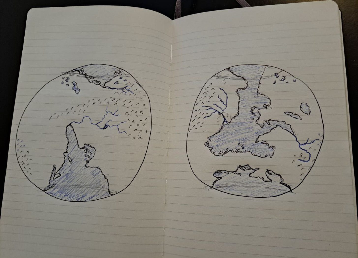 A sketch of two hemispheres of a planet. Notably, it's one continent with two major landbridges connecting the main land masses.