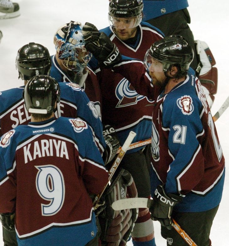 (DENVER, COLO., May 4, 2004) Colorado Avalanche's #21, Peter Forsberg,  right, pats goalie, David Aebischer on the head as Teemu Selanne, Paul  Kariya and Darby Hendrickson gather round follwing the Avlanche 3-1 loss to  the San Jose Sharks in game ...