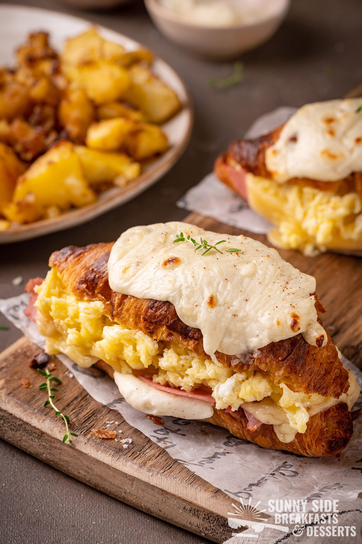 Croque Madame made with croissants and scrambled eggs.