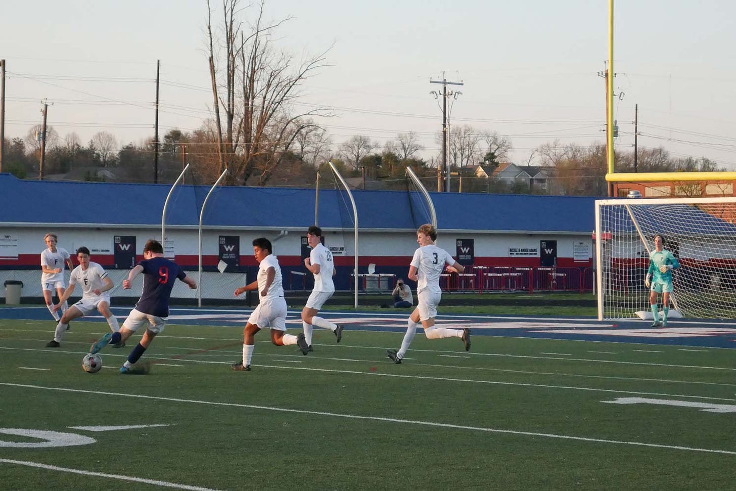 West High boys soccer player shoots at goal
