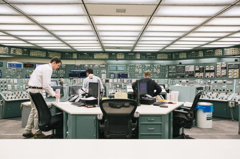 Reactor operators work in the control room at the Three Mile Island nuclear power plant