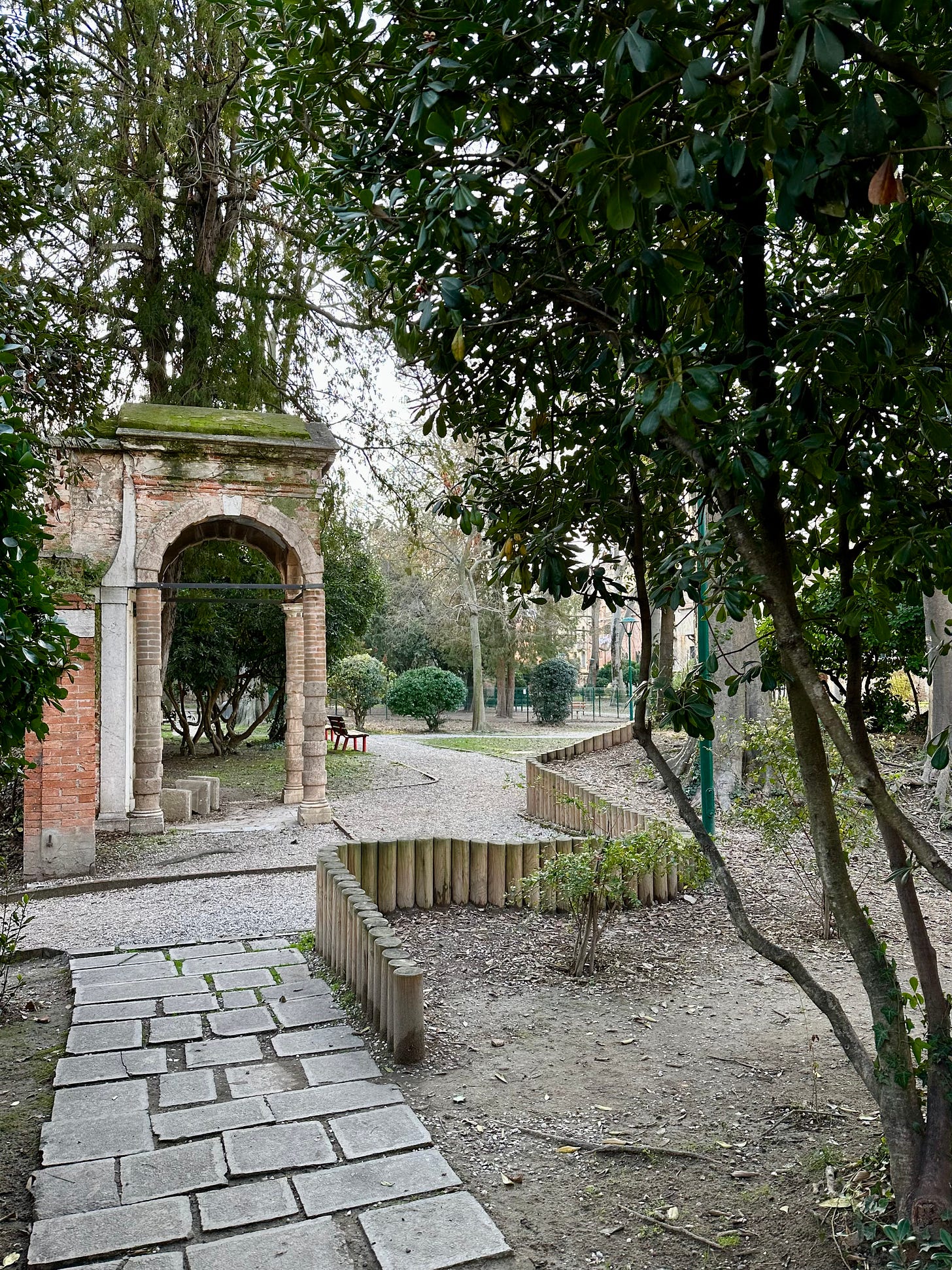 Garden path and stone doorway fragment in the Parco Savorgnan, Venice