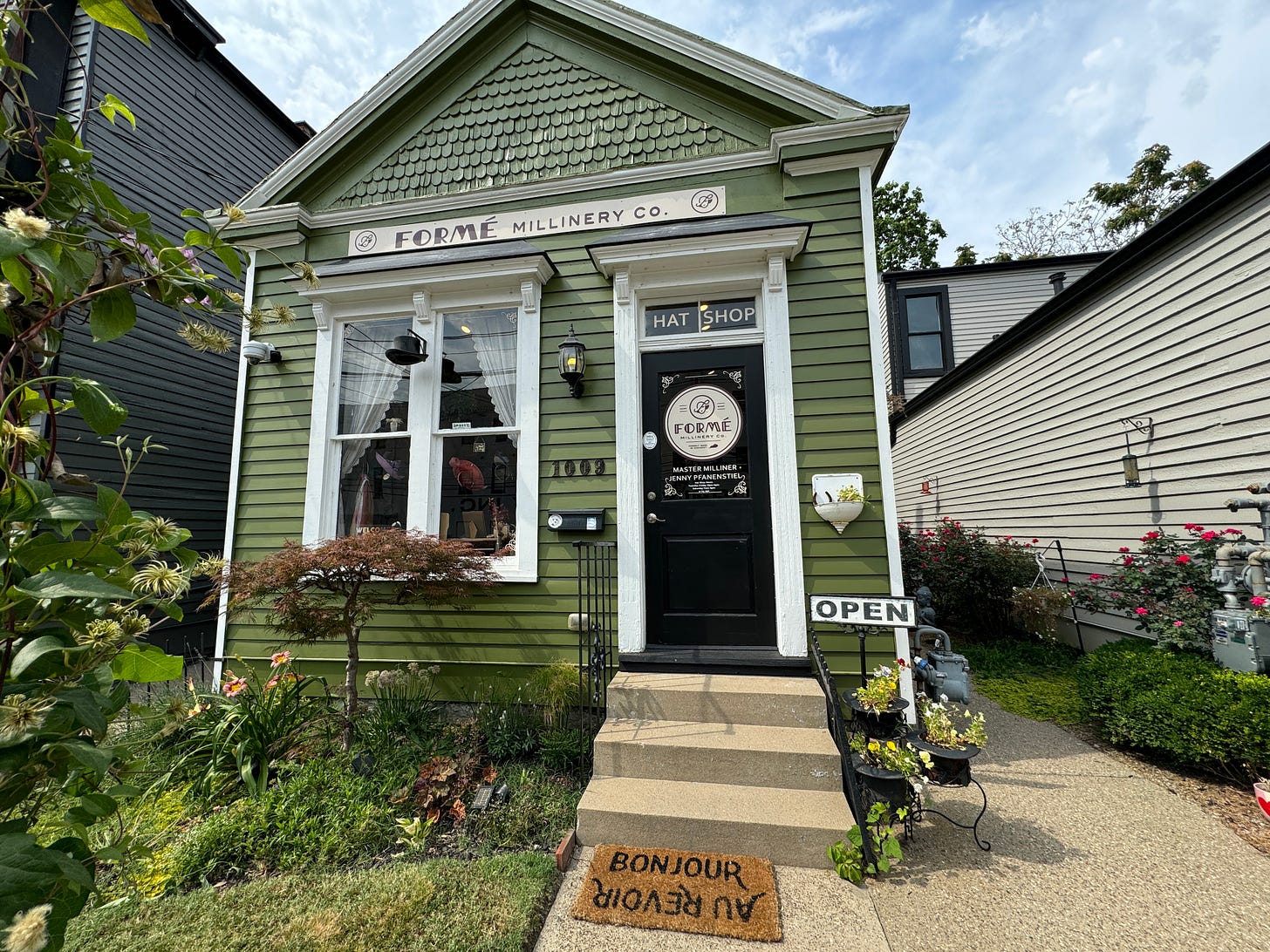 This is an image of the outside of the Formé Millinery shop.