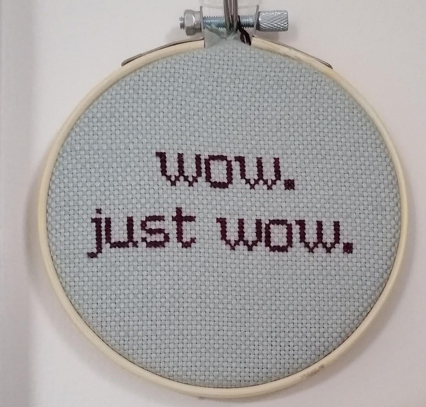 Cross stitch in a hoop. Text reads "wow. just wow."