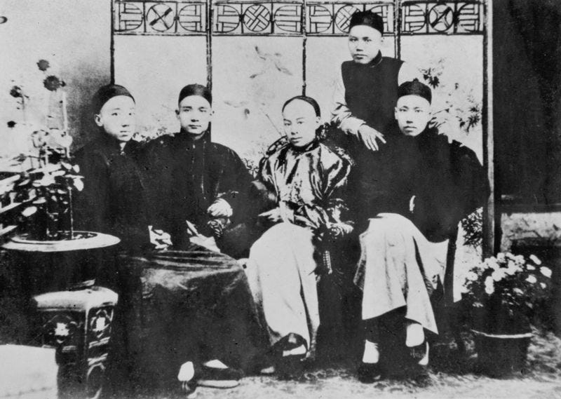 Photograph at the Hong Kong College of Medicine for Chinese (from left to right: Yeung Hok-ling, Sun Yat-sen, Chan Siu-bak and Yau Lit). The one standing was Kwan King-leung. Photo taken circa 1888. Photo: Wikipedia.org, Four Bandits. (2023, November 24).