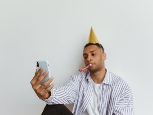 Free Man Holding a Mobile Phone Stock Photo