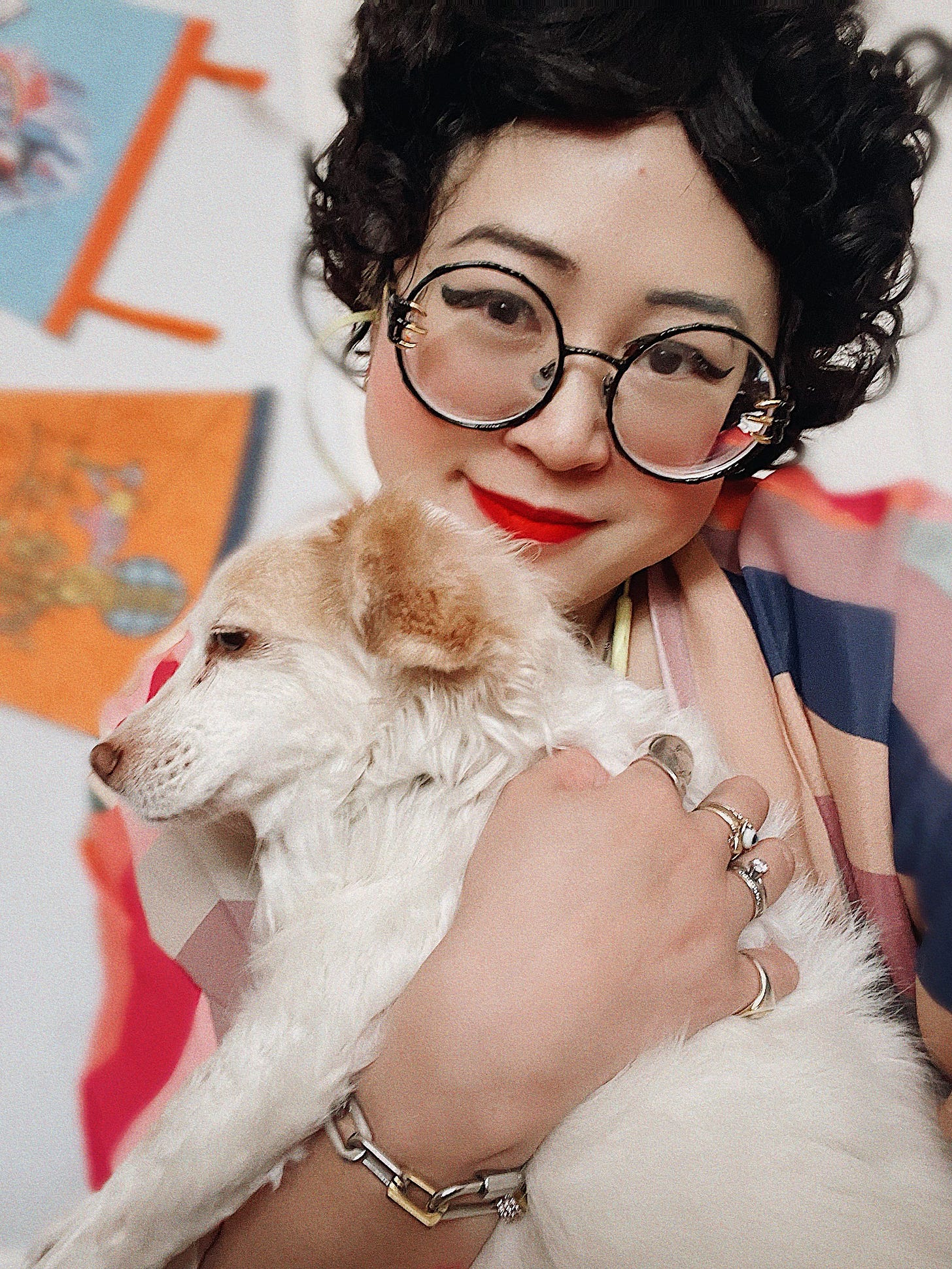 esmé hugging her small white dog