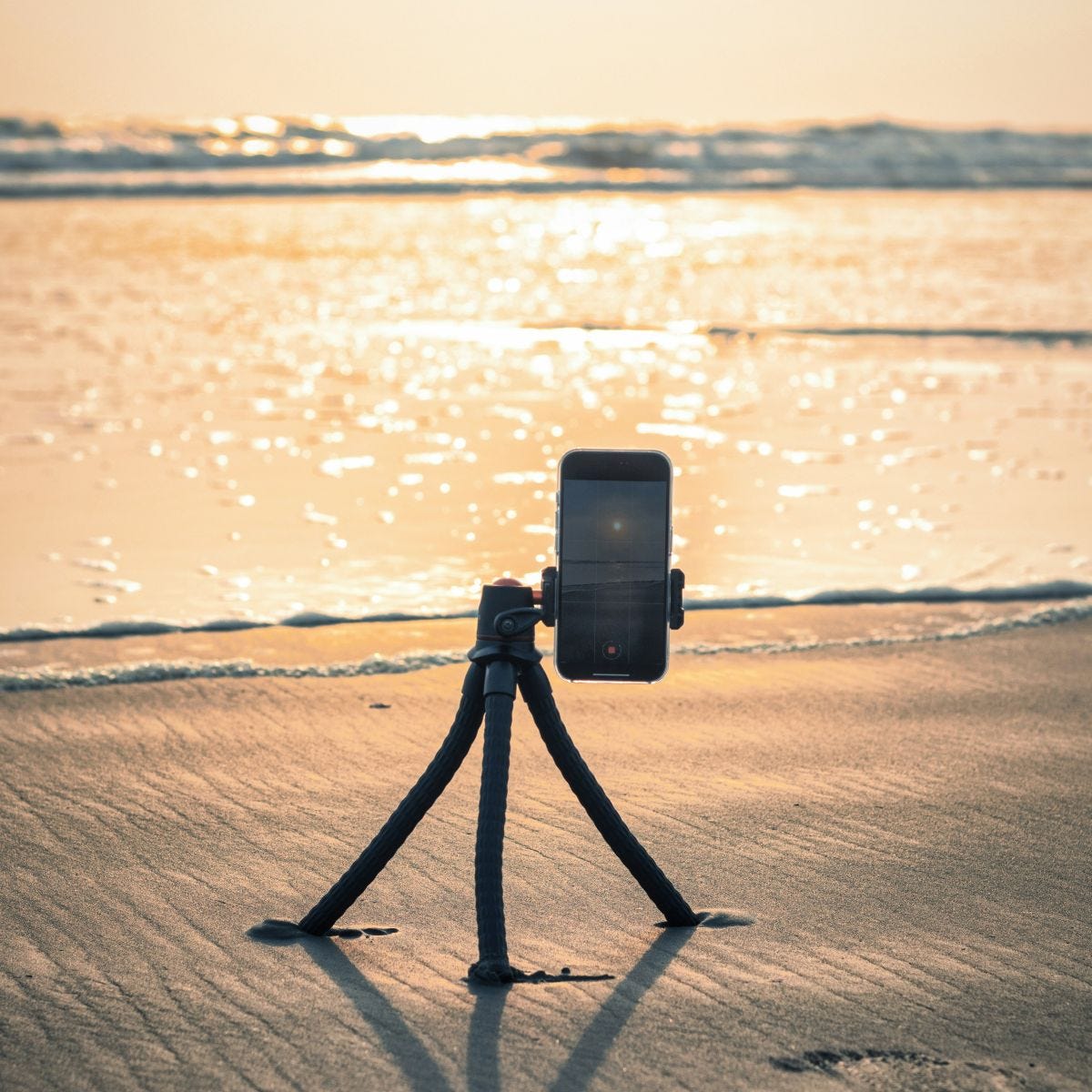 A cell phone - camera filming a sunset A cell phone - camera filming a sunset