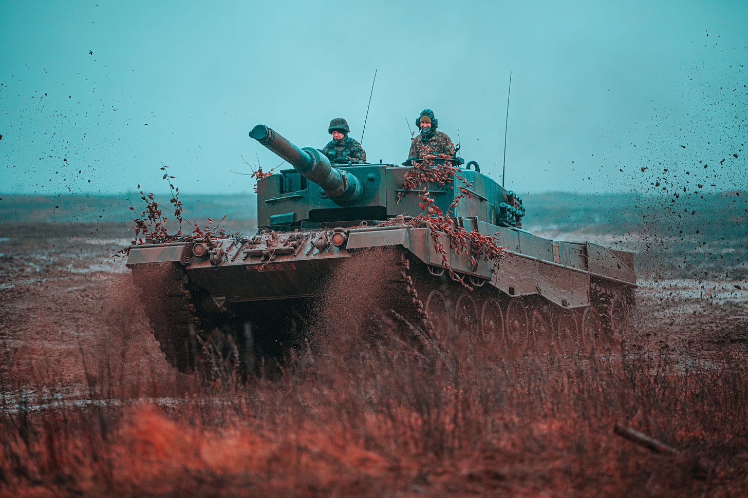 Polish Soldiers, assigned to the 1st Warsaw Armored Brigade operate a Leopard 2 tank during a multinational training scenario where Polish Soldiers, assigned to the 15th Mechanized Brigade, and the 1st Warsaw Armored Brigade trained with Romanian Soldiers, assigned to the Black Bats, 228th Air Defense Battalion, in support of NATO's enhanced Forward Presence Battle Group Poland in Bemowo Piskie, Poland, Feb. 6, 2020. 