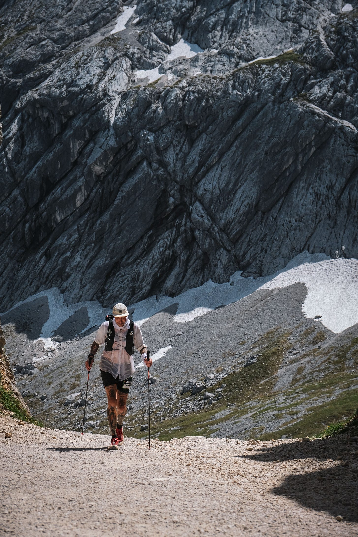 The author in front of a massive mountain wall